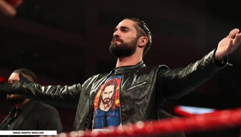 Watch: A fan jumps the barricade and starts walking alongside Seth Rollins